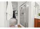 Bright bathroom featuring walk-in shower with glass door, and tiled floor at 4140 E Claxton Ave, Gilbert, AZ 85297