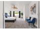 Elegant main bedroom with plush carpet, natural lighting, ceiling fan and stylish decor at 4140 E Claxton Ave, Gilbert, AZ 85297