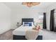 Gorgeous main bedroom with tray, matching nightstands, and plush carpet at 4140 E Claxton Ave, Gilbert, AZ 85297