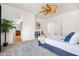 Tranquil primary bedroom boasting a ceiling fan, sitting area, and elegant decor at 4140 E Claxton Ave, Gilbert, AZ 85297