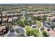 Expansive aerial view of a residential community, showcasing lush parks and well-maintained streets, ideal for Gathering living at 4630 E Navigator Ln, Phoenix, AZ 85050
