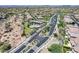 Sweeping aerial view of a neighborhood, highlighting community pool, verdant landscapes and easy access roads at 4630 E Navigator Ln, Phoenix, AZ 85050