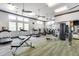 Bright fitness center with state-of-the-art equipment, fans and multiple windows for a motivating workout at 4630 E Navigator Ln, Phoenix, AZ 85050