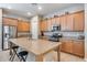 Spacious kitchen island with granite countertops and stainless steel appliances provides plenty of cooking space at 4630 E Navigator Ln, Phoenix, AZ 85050