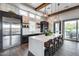 Contemporary kitchen featuring stainless steel appliances, large island and designer lighting fixtures at 4630 E Navigator Ln, Phoenix, AZ 85050