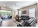 Cozy living room with tile floors, comfortable seating, and a sliding glass door leading to the outdoor patio at 4630 E Navigator Ln, Phoenix, AZ 85050