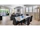 Open-concept living and dining area featuring tile flooring, plenty of natural light, and modern furnishings at 4630 E Navigator Ln, Phoenix, AZ 85050
