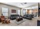 Spacious living area features comfortable leather seating and seamless access to the adjacent dining and kitchen area at 4630 E Navigator Ln, Phoenix, AZ 85050