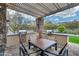 Enjoy outdoor cooking with a built-in grill, dining area, and pergola for a perfect barbecue experience at 4630 E Navigator Ln, Phoenix, AZ 85050