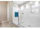 Bright walk-in shower with adjustable shower head, grab bar, and sleek glass door at 4630 E Navigator Ln, Phoenix, AZ 85050