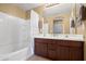 Well-maintained bathroom featuring a double sink vanity, bathtub, and shower at 4743 E Laurel Ave, Gilbert, AZ 85234