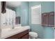 Stylish bathroom featuring blue walls, a modern sink, and fresh towels at 4743 E Laurel Ave, Gilbert, AZ 85234