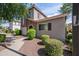 Two-story home with well-maintained landscaping, sidewalk and neutral stucco at 4743 E Laurel Ave, Gilbert, AZ 85234