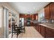 Traditional kitchen with stainless steel appliances and sliding glass door to patio at 4743 E Laurel Ave, Gilbert, AZ 85234