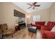 Cozy living room with hardwood floors, modern decor and a large sofa at 4743 E Laurel Ave, Gilbert, AZ 85234
