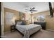 Comfortable main bedroom boasts a ceiling fan, decorative pillows, and artwork, creating a serene atmosphere at 4743 E Laurel Ave, Gilbert, AZ 85234