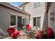 Relaxing outdoor patio space with comfortable red cushioned seating, offering a private and cozy retreat at 4743 E Laurel Ave, Gilbert, AZ 85234