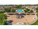 Community playground with vibrant play structures, including swings and slides, fostering a fun and active lifestyle for families at 4743 E Laurel Ave, Gilbert, AZ 85234