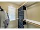 Organized walk-in closet with ample storage solutions, including shelves and hanging rods at 4743 E Laurel Ave, Gilbert, AZ 85234