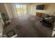 Spacious living room with sliding glass doors for natural light and outdoor access at 4750 N Central Ave # 3S, Phoenix, AZ 85012