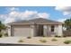 Charming single-story home featuring a neutral color palette, a two car garage, and manicured landscaping at 5512 W Piedmont Rd, Laveen, AZ 85339