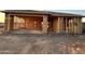 Home exterior displaying the framing of a new construction home with a foundation and a spacious garage at 5512 W Piedmont Rd, Laveen, AZ 85339