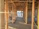 Hallway area framed with wooden beams and studs, showcasing the layout of this modern house at 5512 W Piedmont Rd, Laveen, AZ 85339