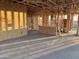 Sunlit living room featuring the wooden framing, showcasing the construction of this modern home at 5512 W Piedmont Rd, Laveen, AZ 85339