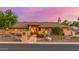 Beautiful single-story home featuring desert landscaping and a tile roof at dusk at 5861 E Anderson Dr, Scottsdale, AZ 85254
