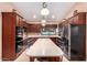 An open concept kitchen, featuring stainless steel appliances, and a large kitchen island at 5861 E Anderson Dr, Scottsdale, AZ 85254