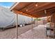 Covered patio with string lights, outdoor grill, and ample space for entertaining or relaxing outdoors at 5861 E Anderson Dr, Scottsdale, AZ 85254