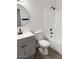Modern bathroom featuring a vanity, toilet, and shower-tub combination at 5975 N 48Th Dr, Glendale, AZ 85301