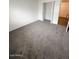 Cozy bedroom featuring soft carpet, a closet, and plenty of natural light at 5975 N 48Th Dr, Glendale, AZ 85301
