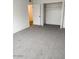 Bedroom featuring light carpet and a closet, creating a bright and airy space at 5975 N 48Th Dr, Glendale, AZ 85301