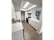 Modern kitchen featuring white cabinets, stainless steel appliances, and updated countertops at 5975 N 48Th Dr, Glendale, AZ 85301