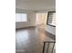 Bright living room featuring tile flooring, a large window, and an open floor plan at 5975 N 48Th Dr, Glendale, AZ 85301