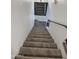 Carpeted staircase with modern railings leading to the upper level of the home at 5975 N 48Th Dr, Glendale, AZ 85301