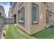 Artificial grass in the backyard offers a green space for relaxation and entertainment at 631 W Winchester Dr, Chandler, AZ 85286