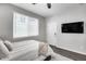 Bedroom features a large TV, soft carpet, natural lighting and neutral paint at 631 W Winchester Dr, Chandler, AZ 85286