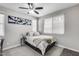 Cozy bedroom offers natural light, a ceiling fan, neutral walls, and closet at 631 W Winchester Dr, Chandler, AZ 85286