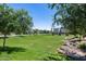 Lush community green with mature trees offering serene views of the neighborhood at 631 W Winchester Dr, Chandler, AZ 85286