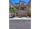Stylish townhome featuring a balcony, brick accents, and a welcoming entrance at 631 W Winchester Dr, Chandler, AZ 85286