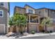 Charming two-story townhome with brick accents, private balcony, and attached garage at 631 W Winchester Dr, Chandler, AZ 85286