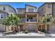 Inviting two-story townhome featuring a private balcony and a brick-accented garage at 631 W Winchester Dr, Chandler, AZ 85286