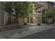 Inviting two-story home with brick accents, a private balcony, and a well-maintained front yard at 631 W Winchester Dr, Chandler, AZ 85286