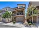 Contemporary two-story townhome features a brick facade and a private balcony at 631 W Winchester Dr, Chandler, AZ 85286