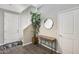 Light and bright foyer has a decorative mirror, table and decorative tree next to the staircase at 631 W Winchester Dr, Chandler, AZ 85286