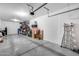 Spacious garage with epoxy flooring and ample overhead storage at 631 W Winchester Dr, Chandler, AZ 85286