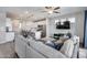 Open-concept living area showcases modern design, a large sectional, and seamless flow to the kitchen at 631 W Winchester Dr, Chandler, AZ 85286