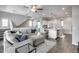 Bright living room featuring modern furnishings, tile floors and an open-concept layout to the kitchen area at 631 W Winchester Dr, Chandler, AZ 85286